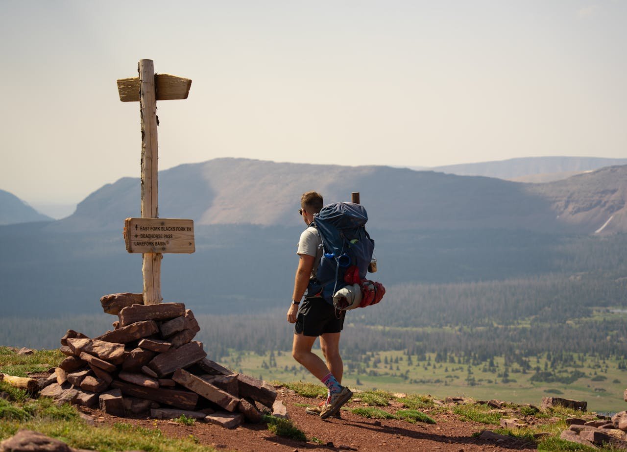 Backpacker hiking with ultralight backpacking gear for long trips in the mountains